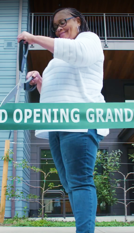 Clara cutting ribbon