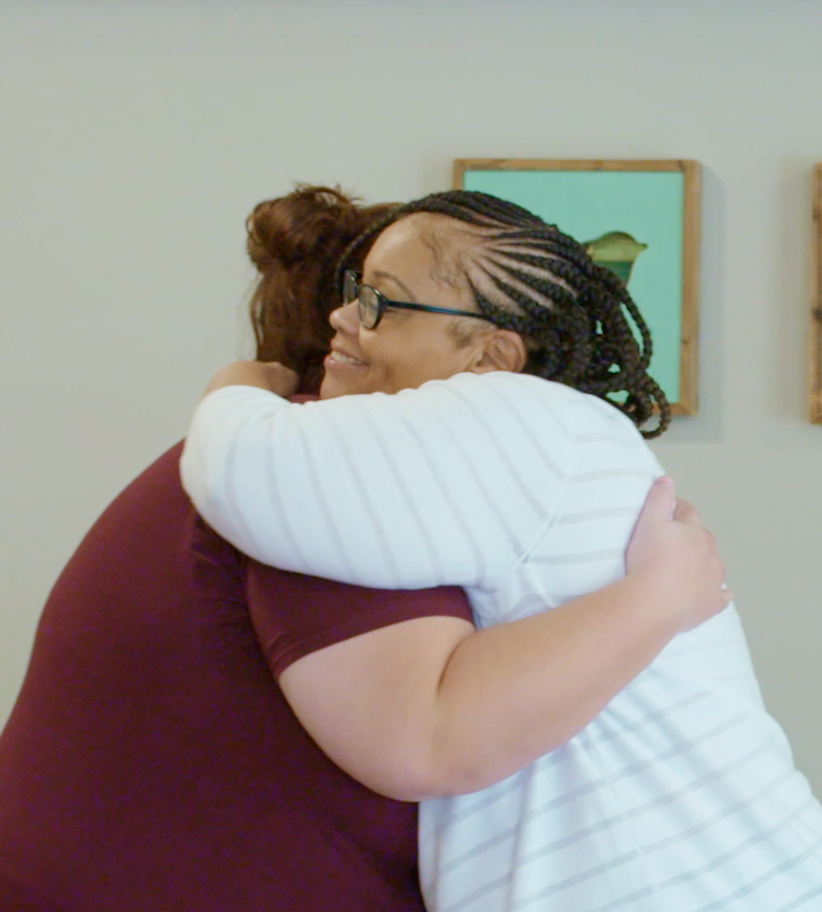 Clara hugging resident